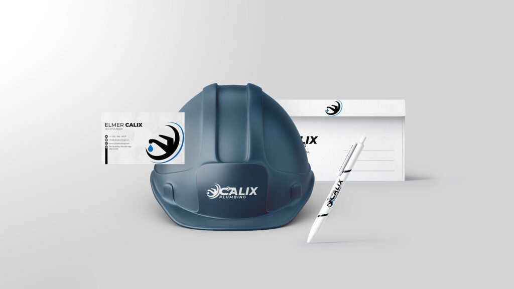 Helmet, business card, pencil and envelope